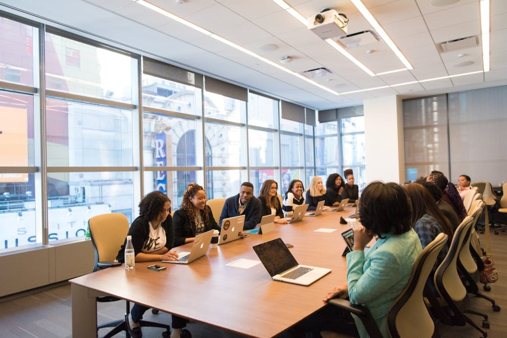 pexels-photo-1181406 A diverse team of business professionals collaborating in a modern meeting room.
